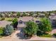 Beautiful gray two-story home featuring mature trees, a turret and an attached two car garage at 2980 Craig Ct, Castle Rock, CO 80109