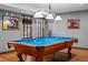 Inviting game room with stylish lighting, a Brunswick pool table, and neutral color scheme at 2980 Craig Ct, Castle Rock, CO 80109
