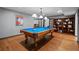 Game room features a pool table, hardwood floors, and built-in bookcase at 2980 Craig Ct, Castle Rock, CO 80109