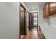 Hallway leading to a bedroom with an open door and counter with cabinets at 2980 Craig Ct, Castle Rock, CO 80109
