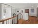 Upstairs hallway with railing and view of living area at 2980 Craig Ct, Castle Rock, CO 80109