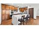 Gourmet kitchen features a large island, stainless steel appliances, and rich dark-stained cabinetry at 2980 Craig Ct, Castle Rock, CO 80109