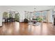 Bright living room with hardwood floors, large windows, and stylish furnishings at 2980 Craig Ct, Castle Rock, CO 80109