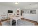 Upstairs Loft featuring hardwood floors, a puzzle station, TV, and white shelving at 2980 Craig Ct, Castle Rock, CO 80109