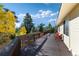 Expansive back deck providing ample space for relaxation and panoramic views of the surrounding nature at 2785 Magpie Ln, Larkspur, CO 80118