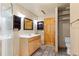 Bathroom featuring tile floors, a standing shower, a vanity with a sink, and wood accents at 2785 Magpie Ln, Larkspur, CO 80118