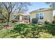 Beautiful backyard with a well-manicured lawn, mature trees, and stamped concrete patio at 7276 Brighton Ct, Castle Pines, CO 80108