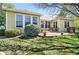 Backyard with large windows, bushes and a patio at 7276 Brighton Ct, Castle Pines, CO 80108