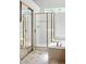 Bathroom with a shower, tub, and large mirror closet doors at 7276 Brighton Ct, Castle Pines, CO 80108