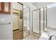 Bright bathroom featuring a shower, and large mirror closet doors at 7276 Brighton Ct, Castle Pines, CO 80108
