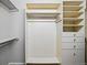 Walk-in closet with shelves and clothes racks at 7276 Brighton Ct, Castle Pines, CO 80108