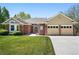Charming home with brick accents, well-kept lawn, and attached two-car garage at 7276 Brighton Ct, Castle Pines, CO 80108