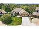 Well maintained home with manicured lawn, mature trees, and a two-car garage at 7276 Brighton Ct, Castle Pines, CO 80108