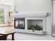 A fireplace with mantel serves as the focal point of the living room at 7276 Brighton Ct, Castle Pines, CO 80108