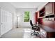 Bright office featuring a built-in desk and large window at 7276 Brighton Ct, Castle Pines, CO 80108