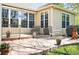 Stamped concrete patio featuring outdoor seating and mature landscaping at 7276 Brighton Ct, Castle Pines, CO 80108