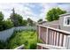 Backyard featuring a wood deck overlooking a fenced yard with trees at 17863 Fringed Sage Way, Parker, CO 80134
