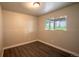 Bedroom featuring hardwood floors, neutral paint, and window at 17863 Fringed Sage Way, Parker, CO 80134