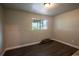 Bedroom featuring hardwood floors, neutral paint, and window at 17863 Fringed Sage Way, Parker, CO 80134