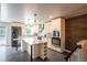 Stylish kitchen with stainless steel appliances, granite countertops, and center island at 17863 Fringed Sage Way, Parker, CO 80134