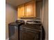 Laundry Room with wood cabinets and Samsung washer and dryer at 17863 Fringed Sage Way, Parker, CO 80134