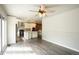 Spacious living area leading to kitchen with modern flooring and natural light at 17863 Fringed Sage Way, Parker, CO 80134