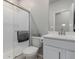 Bathroom with a glass-enclosed shower, white vanity, and modern fixtures at 23998 E Atlantic Pl, Aurora, CO 80018