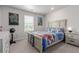 Bedroom featuring a full-size bed, window and modern furnishings at 23998 E Atlantic Pl, Aurora, CO 80018