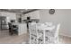 Dining area and kitchen with stainless steel appliances at 23998 E Atlantic Pl, Aurora, CO 80018