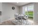 Cozy dining area with a round table and four chairs, great natural light at 23998 E Atlantic Pl, Aurora, CO 80018