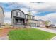Charming two-story home with manicured lawn and long driveway at 23998 E Atlantic Pl, Aurora, CO 80018