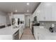 Bright kitchen featuring quartz countertops, stainless steel appliances, and tiled backsplash at 23998 E Atlantic Pl, Aurora, CO 80018
