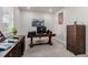 Spacious office features mountain art and wooden desk at 23998 E Atlantic Pl, Aurora, CO 80018