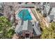 Aerial view of the clubhouse and swimming pool, surrounded by lush landscaping at 6776 S Ivy St # B5, Centennial, CO 80112