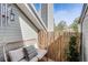 Relaxing balcony with comfortable seating, a bamboo privacy screen, and a view of surrounding greenery at 6776 S Ivy St # B5, Centennial, CO 80112