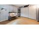 Cozy bedroom featuring hardwood floors, built-in wardrobe, and unique decor creating a comfortable space at 6776 S Ivy St # B5, Centennial, CO 80112
