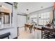 Bright dining area with table and chairs, adjacent to the kitchen, filled with natural light from multiple windows at 6776 S Ivy St # B5, Centennial, CO 80112