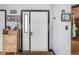 Inviting entryway with decorative accents, wooden storage, and well-lit interior offering a warm welcome at 6776 S Ivy St # B5, Centennial, CO 80112