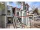 Exterior view of the condo building featuring stairs leading up to the second-floor unit at 6776 S Ivy St # B5, Centennial, CO 80112