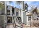 Inviting condo exterior features a well-maintained facade, landscaped grounds, and a welcoming staircase leading to the entrance at 6776 S Ivy St # B5, Centennial, CO 80112