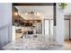 Stylish kitchen boasts granite countertops, stainless steel appliances, dark cabinetry, and subway tile at 6776 S Ivy St # B5, Centennial, CO 80112