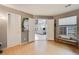 Bright living room showcasing hardwood floors, window bench, and an inviting view of the outdoor scenery at 6776 S Ivy St # B5, Centennial, CO 80112