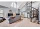 Spacious living room features vaulted ceilings, spiral staircase, cozy seating, and a fireplace, creating an inviting atmosphere at 6776 S Ivy St # B5, Centennial, CO 80112
