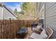 Cozy outdoor patio featuring a bamboo fence, wicker chairs, and an inviting ambiance at 6776 S Ivy St # B5, Centennial, CO 80112