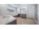 Bathroom featuring double vanity, soaking tub, and glass-enclosed shower, creating a spa-like experience at 18150 Bolero Dr, Parker, CO 80134