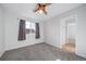 Cozy bedroom featuring neutral carpeting and a window with gray curtains at 18150 Bolero Dr, Parker, CO 80134