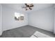 Cozy bedroom featuring a ceiling fan and a window, with neutral carpeting at 18150 Bolero Dr, Parker, CO 80134