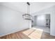 Elegant dining room with hardwood floors and modern light fixture, perfect for entertaining at 18150 Bolero Dr, Parker, CO 80134