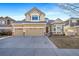 Beautiful two-story home featuring a two-car garage and nicely landscaped front yard at 18150 Bolero Dr, Parker, CO 80134