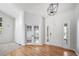 Welcoming foyer with hardwood floors, French doors, and a view into the living space at 18150 Bolero Dr, Parker, CO 80134